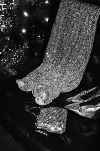 Kaboompics - Silver Glitter Dress With Metallic Accessories On Black Chair