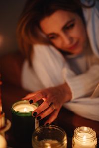 Kaboompics - Cocooning at Home: Woman Resting by Candlelight