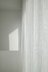 Kaboompics - Close-Up Gray Wall, Sheer Curtain and Geometric Sunlight