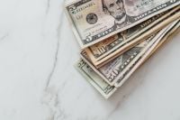 Kaboompics - Stack of US Dollar Bills on White Desk