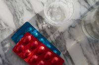 Kaboompics - Red and Blue Medicine Blister Packs on Marble