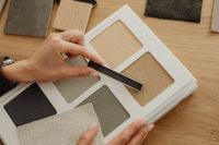 Kaboompics - Hands Comparing Grout and Plaster Samples