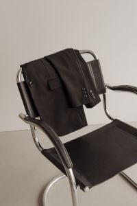 Kaboompics - Black Blazer Draped over Chrome Chair with Handbag