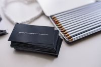 Kaboompics - Branded Black Business Card and Silver Colored Pencils