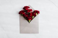 Kaboompics - Minimal Red Carnation Envelope on a White Marble Background