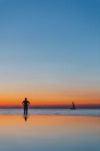 Kaboompics - The man is looking at the sunset by the sea