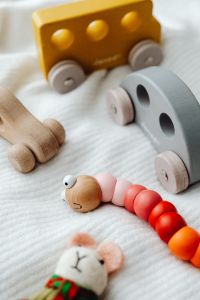 Kaboompics - Wooden Toy Train and Bright Bead Caterpillar for Toddlers