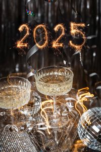 Kaboompics - 2025 Sparkler Numbers With Champagne Coupes And Disco Balls