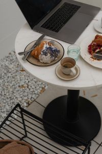 Kaboompics - Laptop, Blue Sprinkle Croissant and Coffee