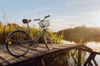 Kaboompics - Bicycle with basket on the pier in bright sunset light