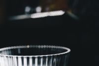 Kaboompics - Ribbed Crystal Bowl Rim Against Dark Background