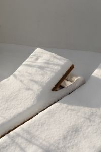 Kaboompics - Folded White Blanket Resting on Snow