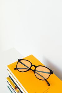 Kaboompics - Vertical Glasses on Yellow Book with Bright Negative Space