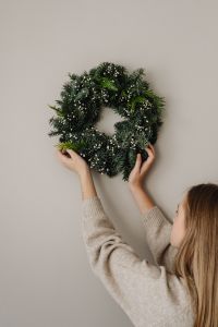 Kaboompics - Christmas Wreath With Hands Against Neutral Background