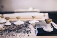 Kaboompics - Big wooden stamps on a dirty table
