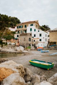 Kaboompics - Small Boats Pulled Ashore Below Hillside Homes in Marina di Puolo