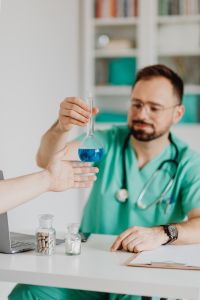 Kaboompics - Doctor Discussing Blue Test Sample With Patient