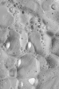 Kaboompics - Soft-Focus Monochrome Facial Foam with Scattered Bubbles, Abstract Skincare Texture