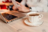 Kaboompics - Coffee Break at a Laptop Desk with Smartphone in the Background