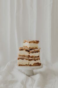 Kaboompics - Stacked Napoleonka Cake Squares on a Pedestal Stand