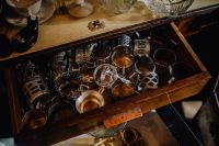 Kaboompics - Vintage Objects Arranged in an Open Wooden Drawer