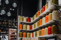 Kaboompics - Rows of Olives and Pickled Vegetables in Glass Jars