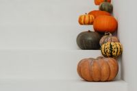 Kaboompics - Pumpkins on White Steps in a Minimal Setting