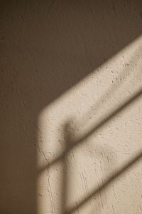 Kaboompics - Geometric Window Shadow on Textured Plaster Wall