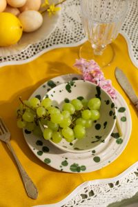 Kaboompics - Green Grapes in Polka Dot Bowl on Yellow Cottagecore Table Setting