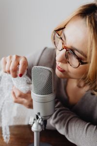 Kaboompics - Woman Playing with Bubble Wrap near a Studio Microphone, ASMR Recording