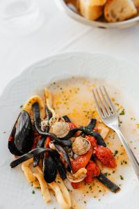 Kaboompics - Partly Eaten Seafood Pasta with Mussels, Clams and Fork