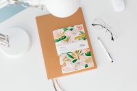 Kaboompics - Overhead View of Colorful Planner on a Brown Notebook