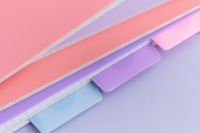 Kaboompics - Pastel Notebook Stack on Pink Background