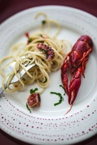 Kaboompics - Close-Up Seafood Pasta with Crayfish and Octopus on Dinner Plate