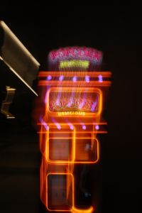 Kaboompics - Layered Light Trails across a Blurred Orange Sign