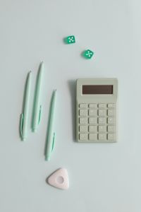 Kaboompics - Pastel Pens and Calculator Flat Lay
