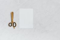 Kaboompics - Scissors on a marble table - copy space
