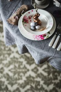 Kaboompics - Round dinner table decorated with easter motifs