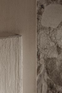 Kaboompics - White Grooved Panel Beside Rough Stone Wall
