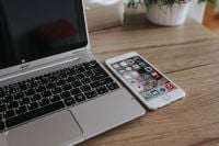 Kaboompics - Silver Acer Laptop And White Apple iPhone On Wooden Desk
