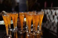 Kaboompics - Rows of Aperol Spritz Cocktails in Warm Party Light
