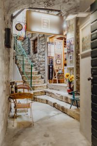 Kaboompics - Rovinj Stone Stairway with Gallery Chairs, Shopfront and Sunflower