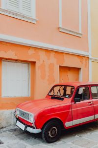 Kaboompics - An old red Renault 4 car parked on the street in Izola, Slovenia