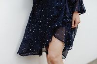 Kaboompics - Cropped Legs in Navy Blue Dress against Minimal White Background