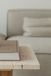Kaboompics - Close-Up of Stacked Coffee Table Books on a Marble Shelf