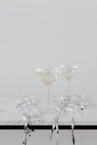 Kaboompics - Minimal Champagne Glasses Against Bright Copy Space