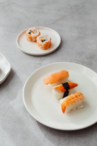Kaboompics - Tobiko Sushi Maki on Small White Plate and Gray Background