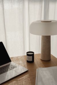 Kaboompics - Minimal Travertine Lamp Against Sheer Curtains