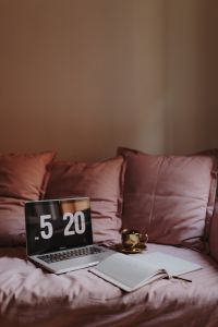 Kaboompics - Soft-Focus Laptop and Coffee on Blush Sofa Cushions