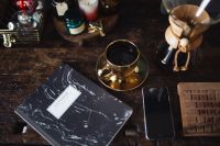 Kaboompics - Notebook, cup of coffee, glasses, Chemex, keyboard, iPhone